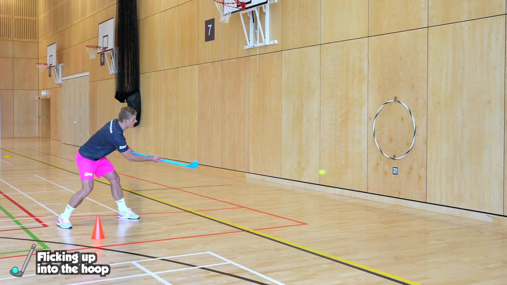 Striking - (Hockey) Flicking up into the hoop